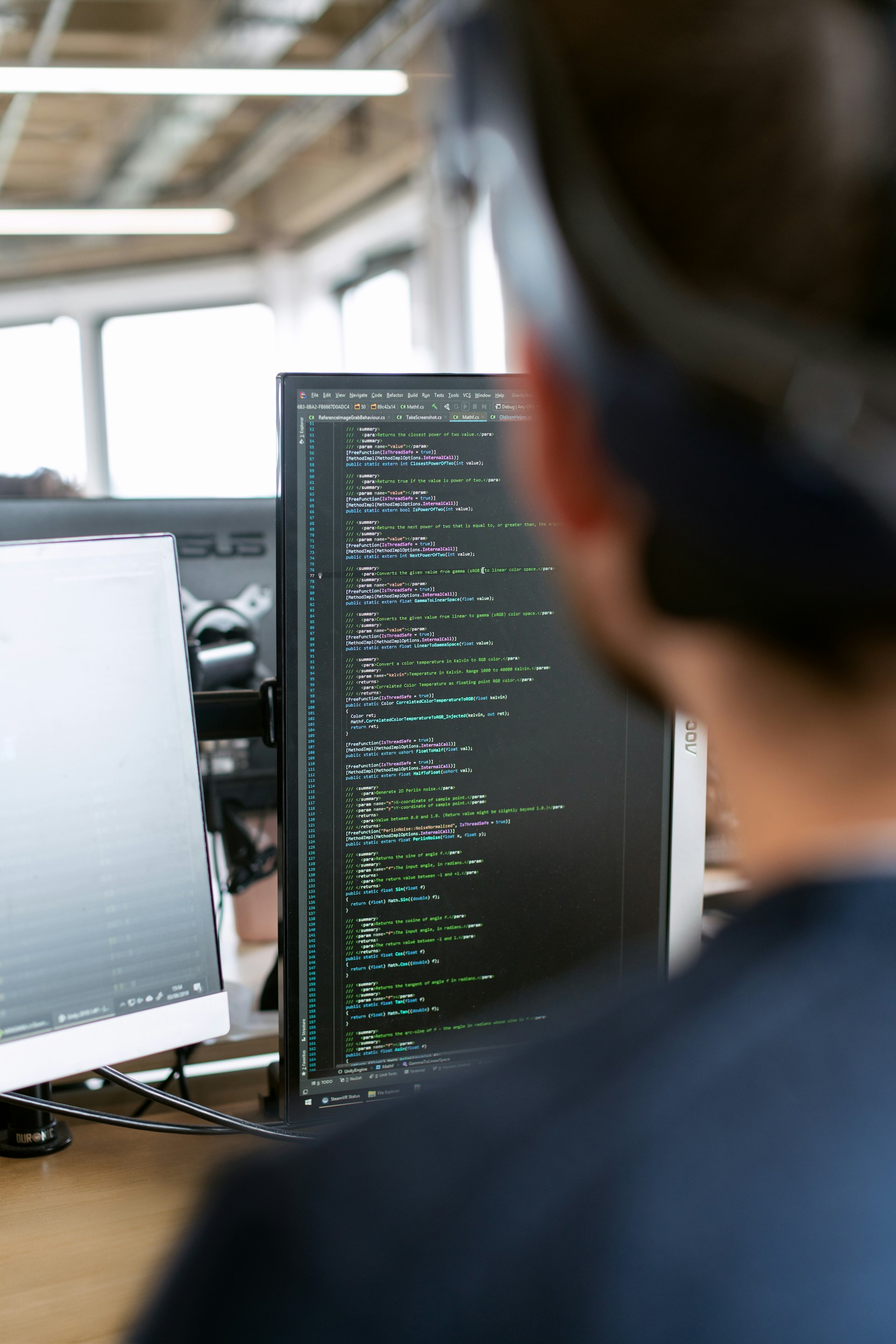 A technician reviewing building-systems data on screen.