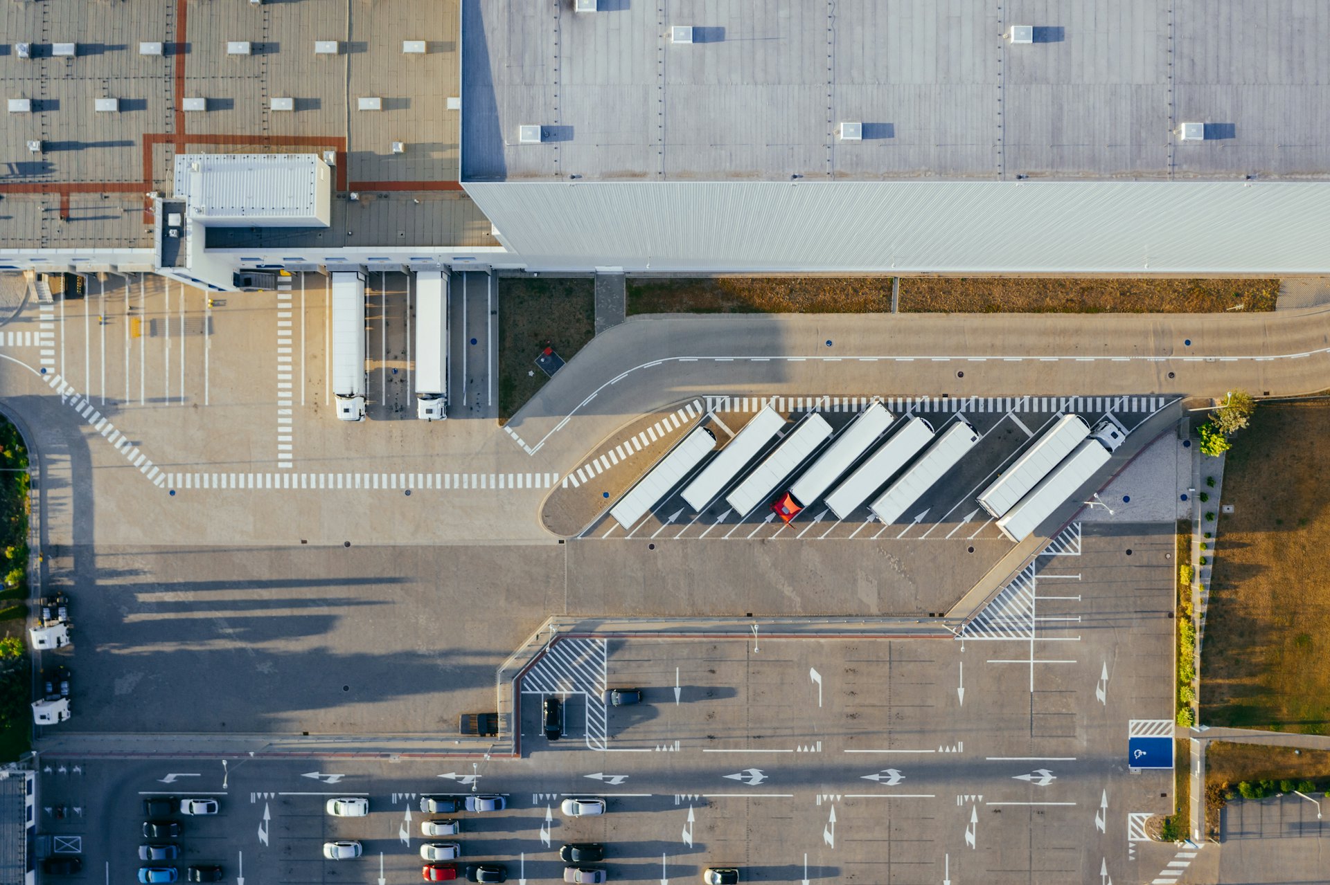 A concrete loading apron with sequential dock doors and level access for trucks.